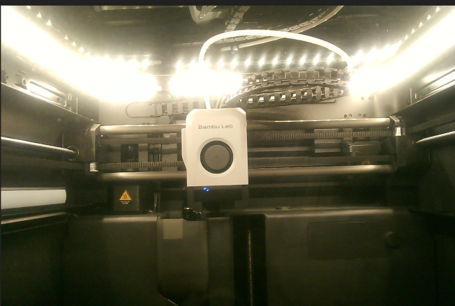 An image of a lightly customised Bambu Labs P1S 3D printer’s webcam stream